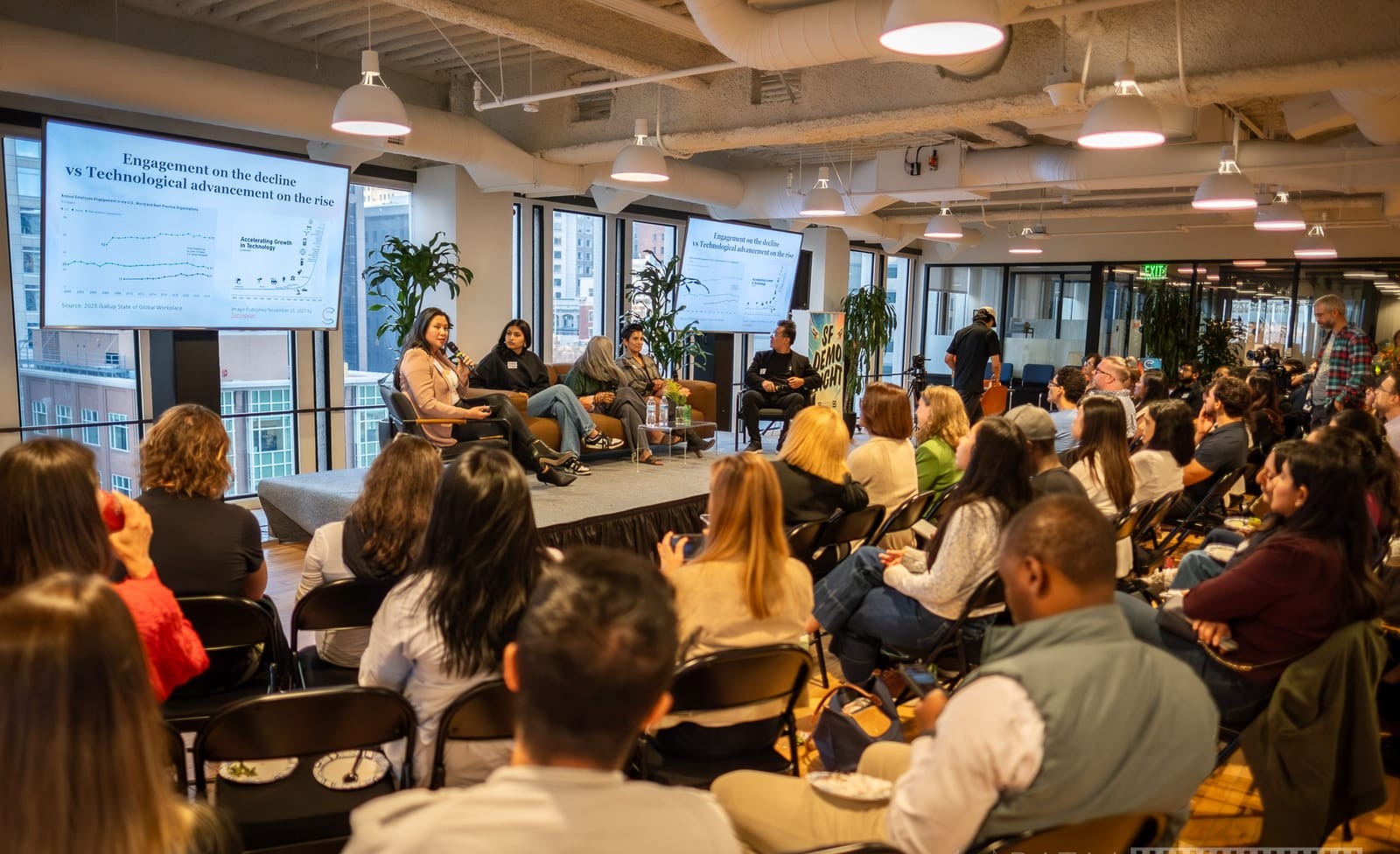 My Luu speaking on a panel discussion in front of a live audience